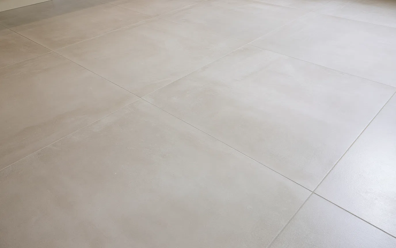 Cleaning product build-up affecting a matte tile floor